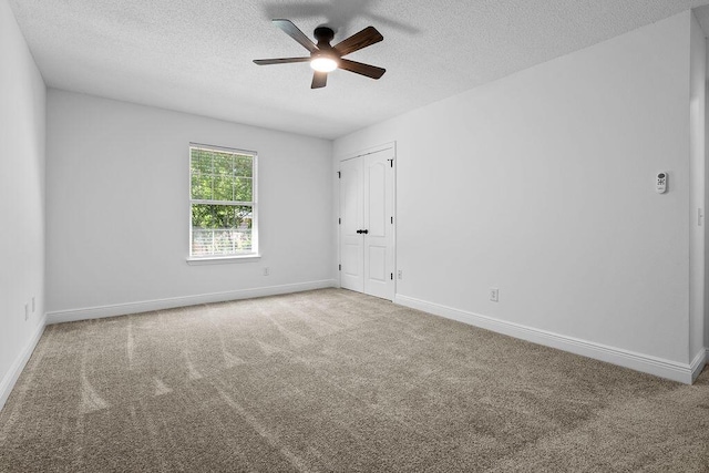 516 Vulpes Sanctuary Loop, Crestview, FL 32536 - unfurnished room with a textured ceiling, carpet flooring, a ceiling fan, and baseboards