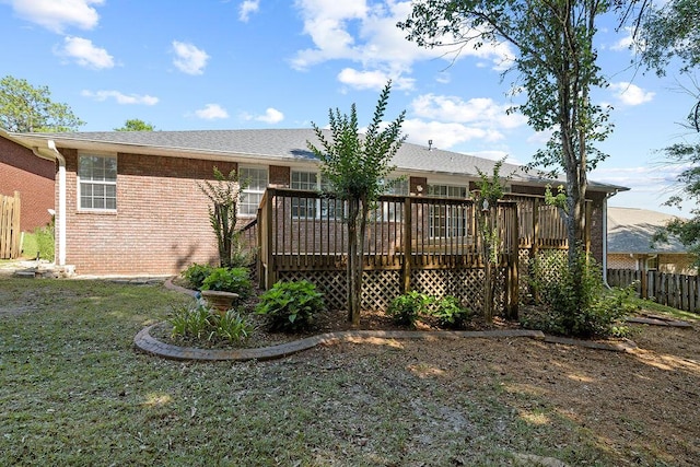516 Vulpes Sanctuary Loop, Crestview, FL 32536 - rear view of property featuring a wooden deck and brick siding