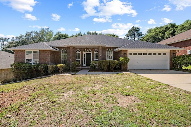 516 Vulpes Sanctuary Loop, Crestview, FL 32536 - ranch-style house with a garage, a front yard, concrete driveway, and brick siding