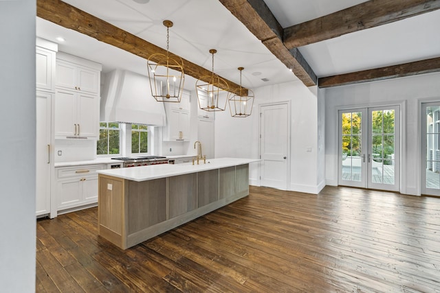 80 Shore Bridge Cir, Inlet Beach, FL 32461 - kitchen featuring custom range hood, beamed ceiling, dark wood finished floors, light countertops, and white cabinets