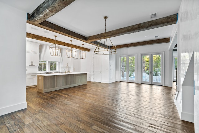 80 Shore Bridge Cir, Inlet Beach, FL 32461 - kitchen with a chandelier, open floor plan, custom range hood, white cabinetry, and dark wood-type flooring