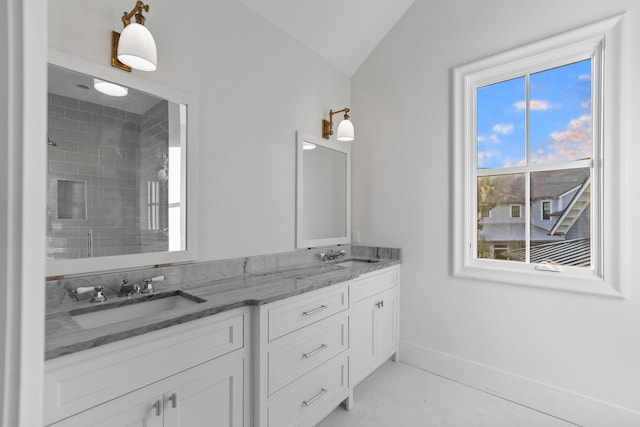 80 Shore Bridge Cir, Inlet Beach, FL 32461 - full bath with double vanity, a tile shower, lofted ceiling, and baseboards