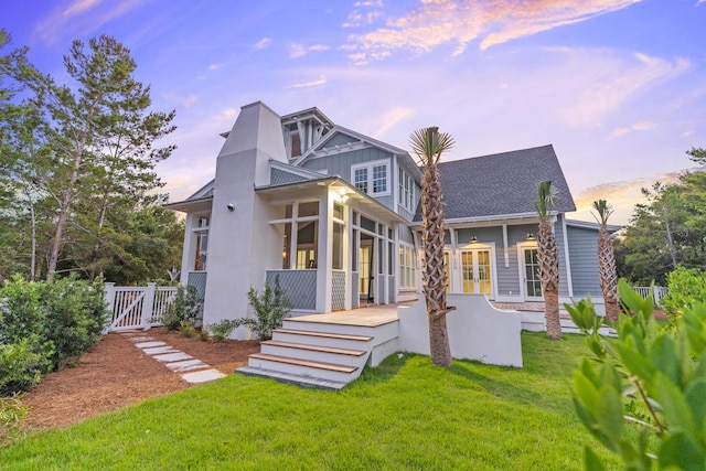 80 Shore Bridge Cir, Inlet Beach, FL 32461 - rear view of house featuring a gate, a sunroom, and french doors