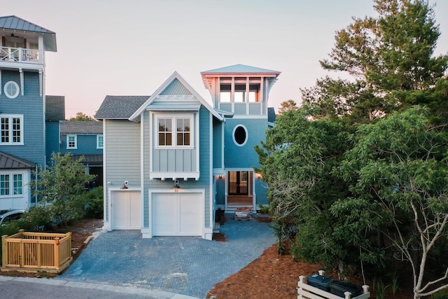 80 Shore Bridge Cir, Inlet Beach, FL 32461 - raised beach house with decorative driveway, a garage, and a balcony