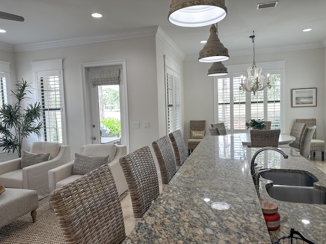 1893 Baytowne Loop, Miramar Beach, FL 32550 - dining room with a chandelier, crown molding, and recessed lighting