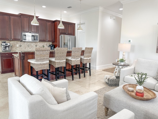 1893 Baytowne Loop, Miramar Beach, FL 32550 - kitchen with appliances with stainless steel finishes, a breakfast bar area, tasteful backsplash, open floor plan, and pendant lighting
