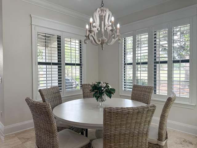 1893 Baytowne Loop, Miramar Beach, FL 32550 - dining room featuring a chandelier, baseboards, ornamental molding, and plenty of natural light