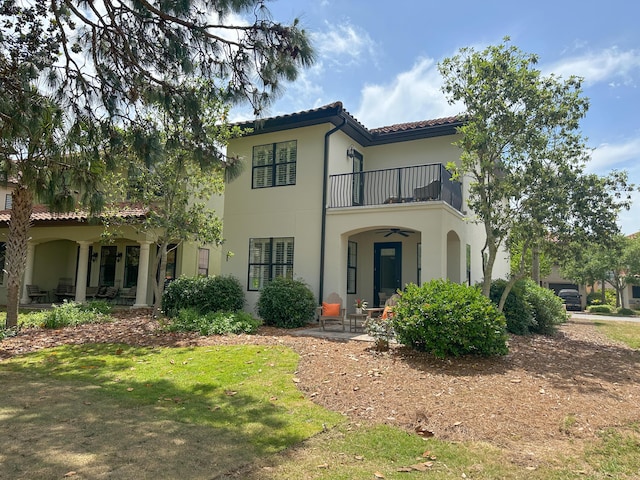 1893 Baytowne Loop, Miramar Beach, FL 32550 - mediterranean / spanish house with a balcony, a tiled roof, and stucco siding