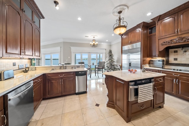 107 Alabama Ave, Lynn Haven, FL 32444 - kitchen with appliances with stainless steel finishes, a sink, a chandelier, decorative backsplash, and crown molding