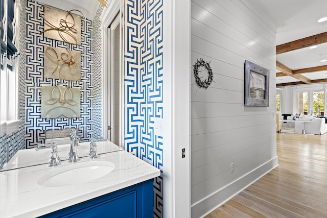 29 Tidal Bridge Way, Watersound, FL 32461 - bathroom with beamed ceiling, vanity, and wood finished floors