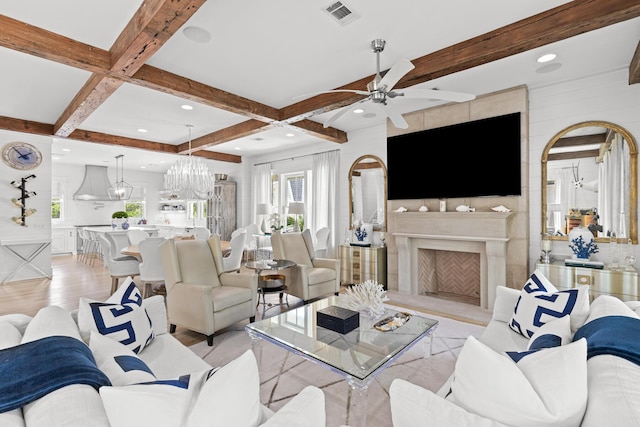 29 Tidal Bridge Way, Watersound, FL 32461 - living room with light wood-style floors, beamed ceiling, ceiling fan, a fireplace with raised hearth, and coffered ceiling