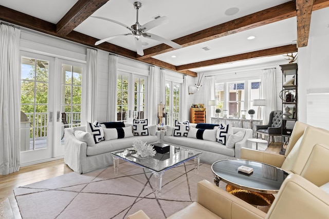 29 Tidal Bridge Way, Watersound, FL 32461 - living area featuring beamed ceiling, wood finished floors, a ceiling fan, and french doors