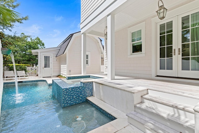 29 Tidal Bridge Way, Watersound, FL 32461 - outdoor pool featuring french doors, a hot tub, and a wooden deck