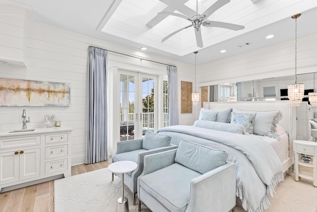 29 Tidal Bridge Way, Watersound, FL 32461 - bedroom featuring a sink, access to outside, a raised ceiling, light wood finished floors, and recessed lighting