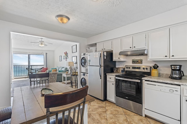 3692 E County Highway 30a Unit 9, Santa Rosa Beach, FL 32459 - kitchen with electric stove, stacked washer / dryer, dishwasher, freestanding refrigerator, and under cabinet range hood