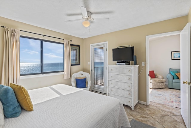 3692 E County Highway 30a Unit 9, Santa Rosa Beach, FL 32459 - bedroom with access to exterior, ceiling fan, baseboards, and light tile patterned floors