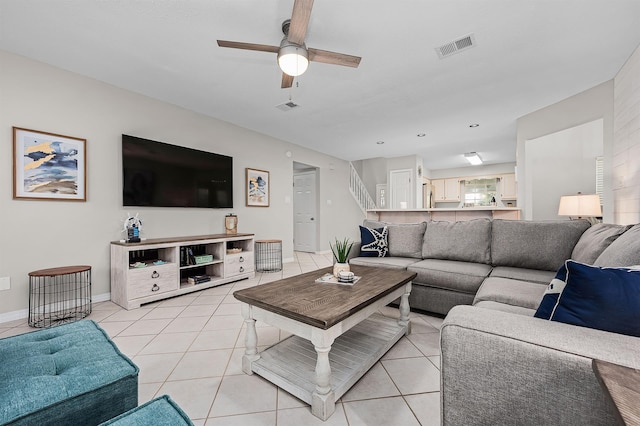 114 Mainsail Dr Unit C28, Miramar Beach, FL 32550 - living area featuring light tile patterned floors, ceiling fan, and baseboards