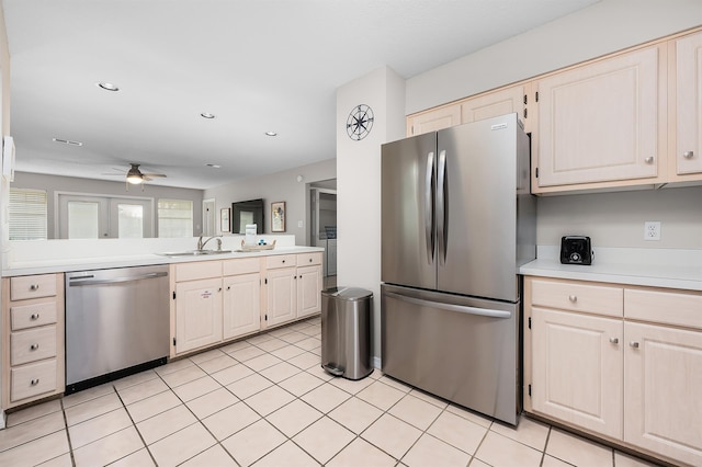 114 Mainsail Dr Unit C28, Miramar Beach, FL 32550 - kitchen featuring appliances with stainless steel finishes, light countertops, a ceiling fan, a sink, and light tile patterned floors