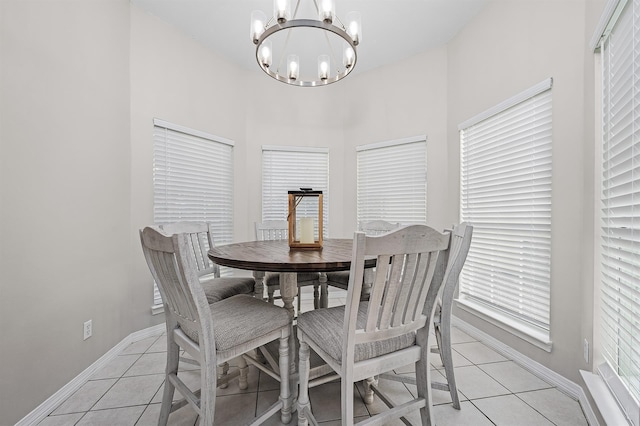 114 Mainsail Dr Unit C28, Miramar Beach, FL 32550 - dining space with light tile patterned floors, a chandelier, and baseboards