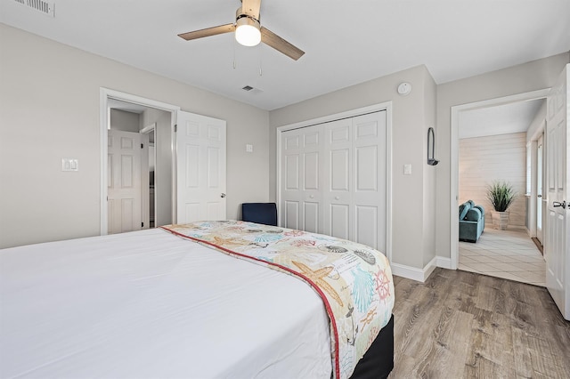 114 Mainsail Dr Unit C28, Miramar Beach, FL 32550 - bedroom with wood finished floors, a closet, baseboards, and a ceiling fan