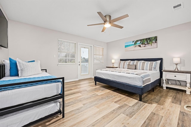114 Mainsail Dr Unit C28, Miramar Beach, FL 32550 - bedroom featuring wood finished floors, access to exterior, baseboards, and a ceiling fan