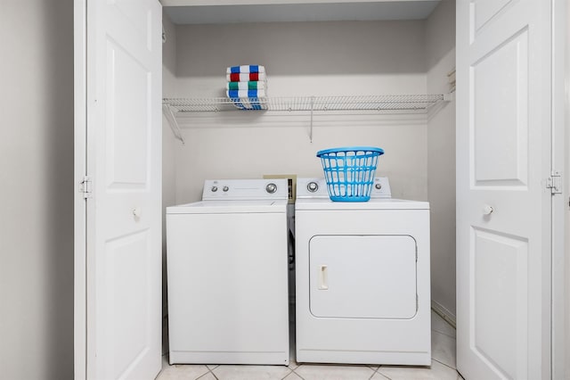 114 Mainsail Dr Unit C28, Miramar Beach, FL 32550 - washroom with separate washer and dryer and light tile patterned floors