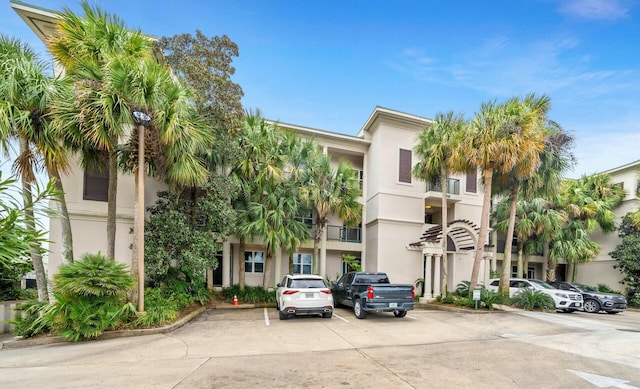 602 Harbor Blvd Unit 201, Destin, FL 32541 - view of building exterior with uncovered parking