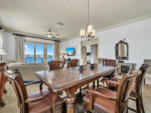 602 Harbor Blvd Unit 201, Destin, FL 32541 - dining room with ornamental molding, ceiling fan, and a chandelier