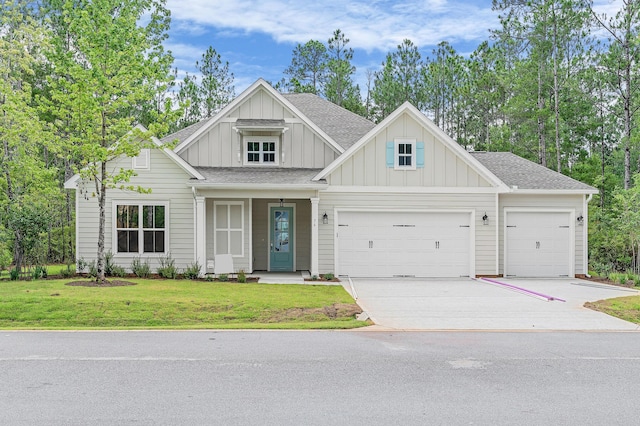 0000 E Bayou Forest Dr Lot 21, Freeport, FL 32439 - view of front of house featuring board and batten siding, a garage, concrete driveway, a front lawn, and roof with shingles