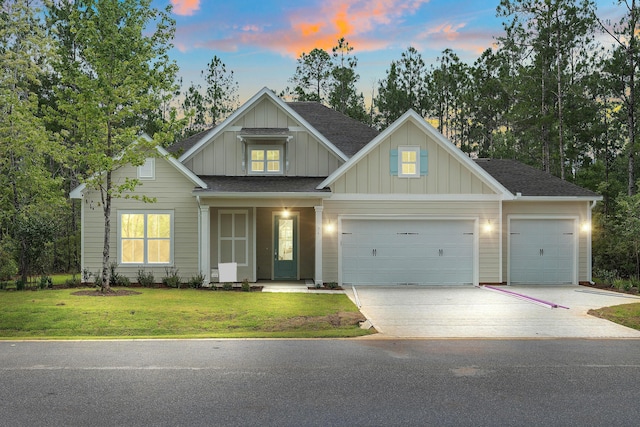 0000 E Bayou Forest Dr Lot 21, Freeport, FL 32439 - view of front facade featuring a garage, concrete driveway, board and batten siding, a front yard, and a shingled roof