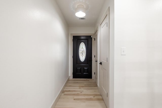 538 22nd St, Niceville, FL 32578 - doorway to outside with light wood-type flooring and baseboards