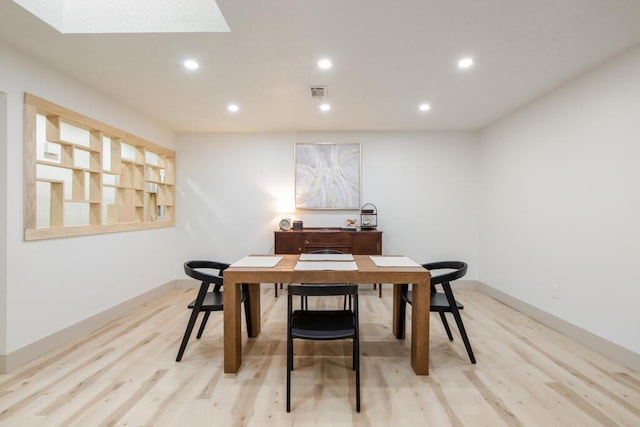 538 22nd St, Niceville, FL 32578 - dining room with recessed lighting, light wood-type flooring, baseboards, and a skylight