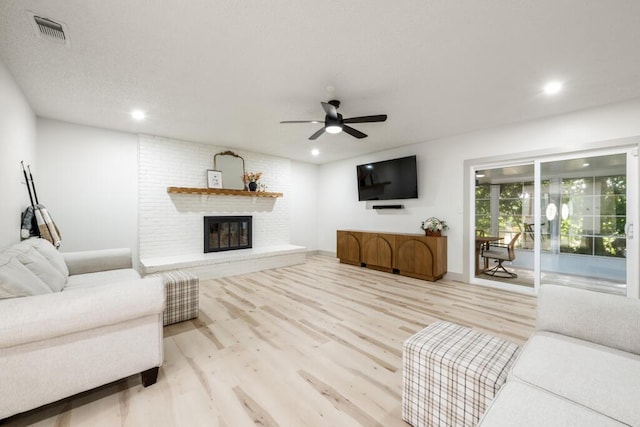 538 22nd St, Niceville, FL 32578 - living room with ceiling fan, wood finished floors, a fireplace, and recessed lighting