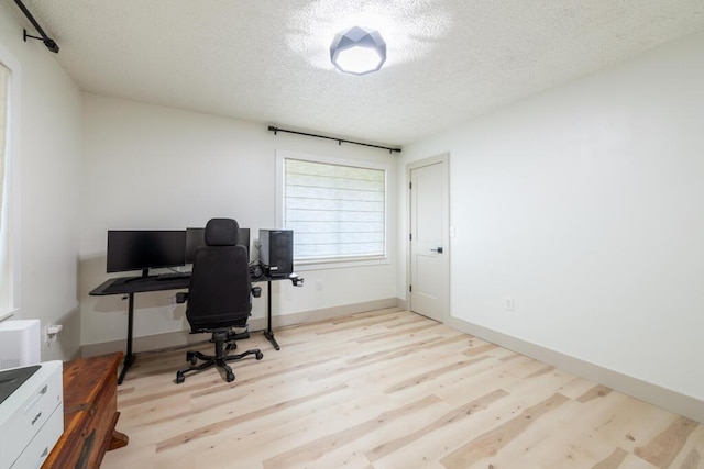 538 22nd St, Niceville, FL 32578 - home office with a textured ceiling and wood finished floors
