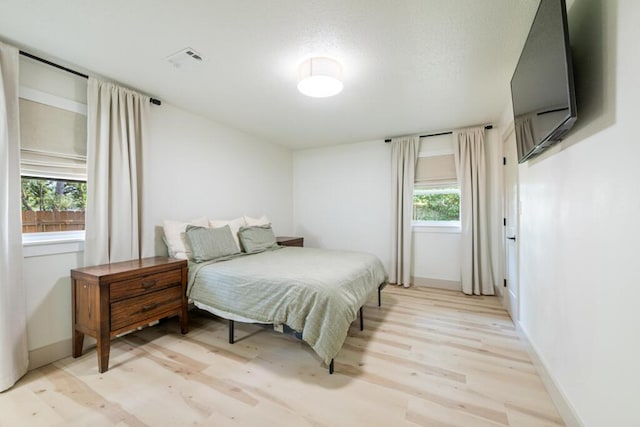 538 22nd St, Niceville, FL 32578 - bedroom featuring light wood-style floors and baseboards