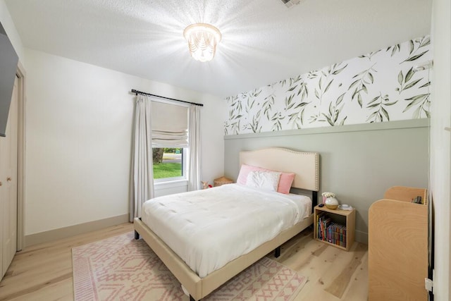 538 22nd St, Niceville, FL 32578 - bedroom with wood finished floors and baseboards