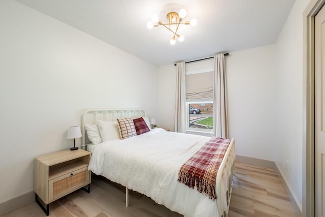 538 22nd St, Niceville, FL 32578 - bedroom with light wood-type flooring and baseboards