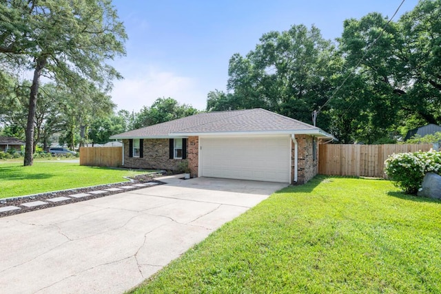 538 22nd St, Niceville, FL 32578 - ranch-style home featuring a garage, driveway, brick siding, and a shingled roof