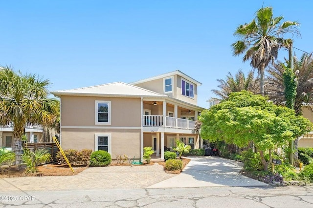 104 Derondo St, Panama City Beach, FL 32413 - view of front of home featuring a balcony, ceiling fan, and stucco siding