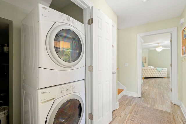 104 Derondo St, Panama City Beach, FL 32413 - laundry room featuring stacked washer / dryer, light wood-style flooring, baseboards, and ceiling fan