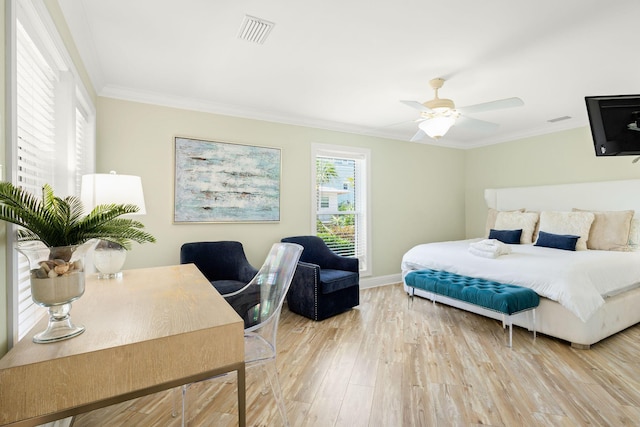 104 Derondo St, Panama City Beach, FL 32413 - bedroom with light wood-type flooring, ornamental molding, baseboards, and a ceiling fan