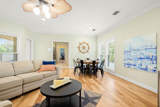 104 Derondo St, Panama City Beach, FL 32413 - living room with crown molding, light wood finished floors, baseboards, ceiling fan, and recessed lighting
