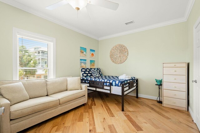 104 Derondo St, Panama City Beach, FL 32413 - bedroom featuring crown molding, light wood finished floors, baseboards, and a ceiling fan