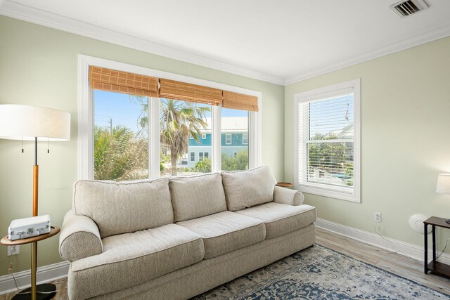 104 Derondo St, Panama City Beach, FL 32413 - living area featuring ornamental molding, baseboards, and wood finished floors