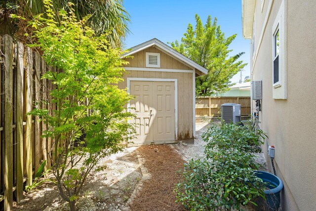 104 Derondo St, Panama City Beach, FL 32413 - view of shed featuring a fenced backyard and central AC unit