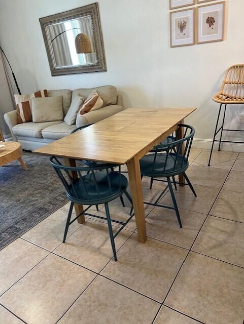 17757 Front Beach Rd Unit 1205C, Panama City Beach, FL 32413 - dining room featuring light tile patterned flooring and baseboards