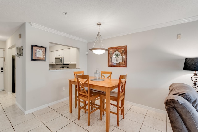 4270 Calinda Ln Unit 343, Niceville, FL 32578 - dining area with light tile patterned flooring, crown molding, and baseboards
