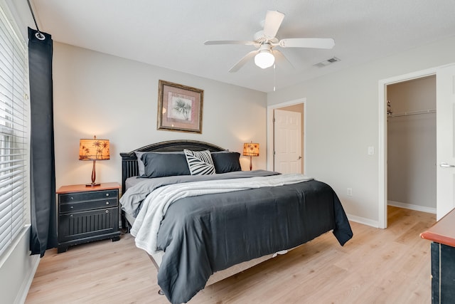 4270 Calinda Ln Unit 343, Niceville, FL 32578 - bedroom featuring light wood finished floors, baseboards, ceiling fan, a spacious closet, and a closet