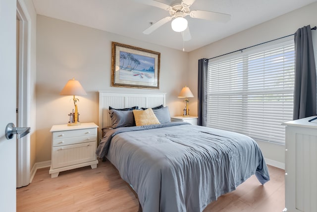 4270 Calinda Ln Unit 343, Niceville, FL 32578 - bedroom featuring light wood-style flooring, baseboards, and a ceiling fan
