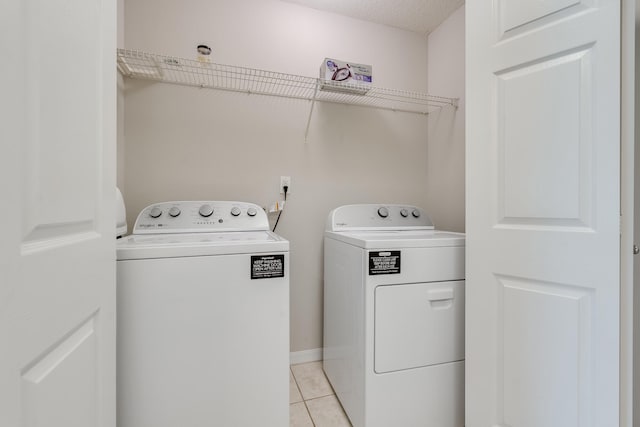 4270 Calinda Ln Unit 343, Niceville, FL 32578 - laundry area featuring separate washer and dryer and light tile patterned flooring